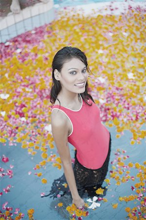 High angle view of a young woman standing in a swimming pool Stock Photo - Premium Royalty-Free, Code: 630-01079188