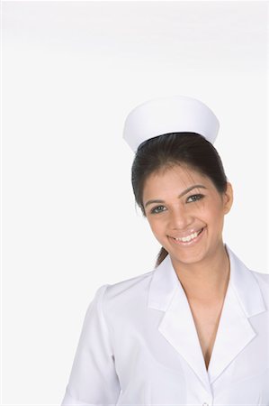 simsearch:640-01364042,k - Portrait of a female nurse smiling Stock Photo - Premium Royalty-Free, Code: 630-01080071