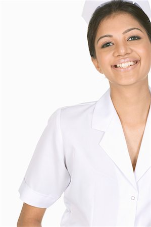 simsearch:640-01364042,k - Portrait of a female nurse smiling Stock Photo - Premium Royalty-Free, Code: 630-01080073