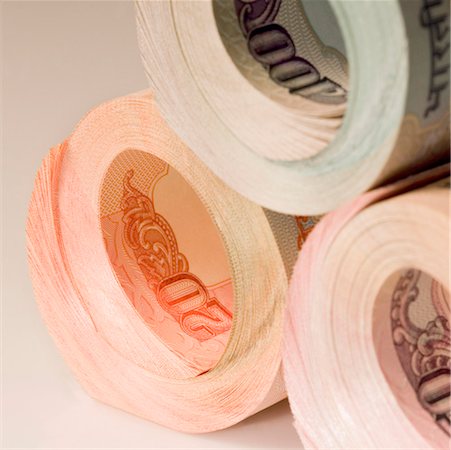 Close-up of a stack of rolled up Indian banknotes Stock Photo - Premium Royalty-Free, Code: 630-01126754