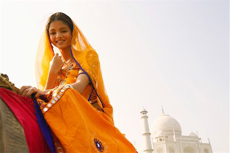 simsearch:857-03193051,k - Low angle view of a young woman smiling, Taj Mahal, Agra, Uttar Pradesh, India Stock Photo - Premium Royalty-Free, Code: 630-01128069