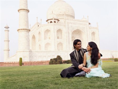 Young couple sitting in front of a mausoleum, Taj Mahal, Agra, Uttar Pradesh, India Stock Photo - Premium Royalty-Free, Code: 630-01128825