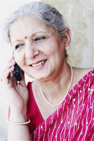simsearch:630-01076466,k - Close-up of a mature woman talking on a mobile phone Stock Photo - Premium Royalty-Free, Code: 630-01130451