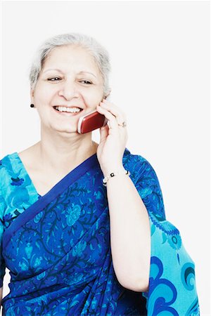 simsearch:630-01076466,k - Close-up of a mature woman talking on a mobile phone Stock Photo - Premium Royalty-Free, Code: 630-01130740