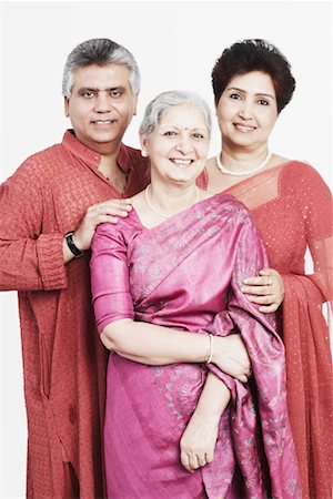 simsearch:630-01076466,k - Portrait of a mature woman standing with a mature couple Stock Photo - Premium Royalty-Free, Code: 630-01130989