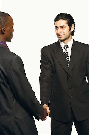 Close-up of two businessmen shaking hands Stock Photo - Premium Royalty-Free, Code: 630-01131206