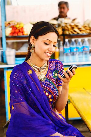 simsearch:630-01076466,k - Close-up of a young woman looking at a mobile phone Stock Photo - Premium Royalty-Free, Code: 630-01131514
