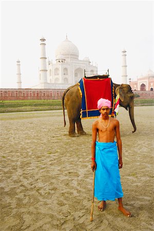 simsearch:630-03481463,k - Young man standing in front of an elephant near a mausoleum, Taj Mahal, Agra, Uttar Pradesh, India Stock Photo - Premium Royalty-Free, Code: 630-01131577