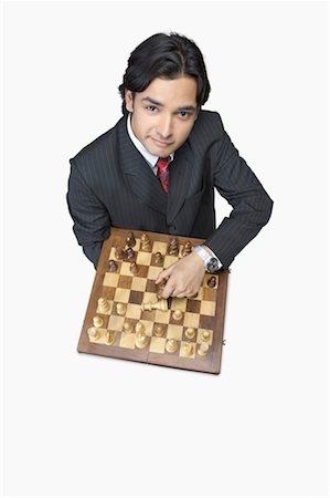 simsearch:640-01350815,k - High angle view of a businessman holding a chessboard Stock Photo - Premium Royalty-Free, Code: 630-01191669