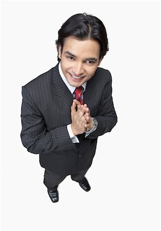 simsearch:640-01350815,k - High angle view of a businessman greeting and smiling Stock Photo - Premium Royalty-Free, Code: 630-01191670