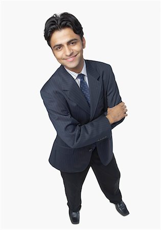 simsearch:640-01350815,k - High angle view of a businessman standing with his arms crossed and smiling Stock Photo - Premium Royalty-Free, Code: 630-01191684
