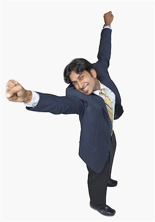 simsearch:640-01350815,k - High angle view of a businessman standing with his arms raised and smiling Stock Photo - Premium Royalty-Free, Code: 630-01191686
