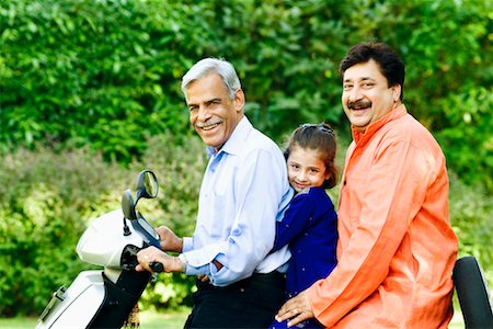 simsearch:630-01296751,k - Portrait of a senior man with his son and granddaughter riding a motor scooter Stock Photo - Premium Royalty-Free, Code: 630-01296757