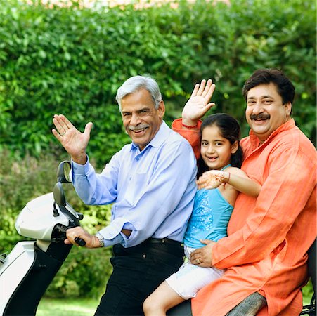 simsearch:630-01296756,k - Portrait of a senior man with his son and granddaughter riding a motor scooter Foto de stock - Sin royalties Premium, Código: 630-01296789