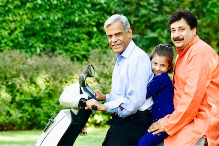 simsearch:630-01296751,k - Portrait of a senior man with his son and granddaughter riding a motor scooter Stock Photo - Premium Royalty-Free, Code: 630-01296890