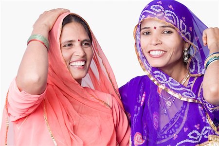 rajasthan clothes for women - Close-up of two young women smiling Stock Photo - Premium Royalty-Free, Code: 630-01490641
