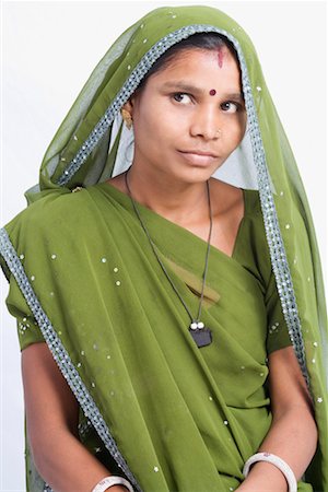 rajasthan clothes for women - Close-up of a young woman looking away Stock Photo - Premium Royalty-Free, Code: 630-01490729