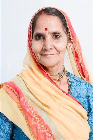 rajasthan clothes for women - Portrait of a senior woman smiling Stock Photo - Premium Royalty-Free, Code: 630-01490735