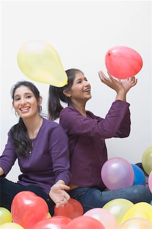 simsearch:630-01491738,k - Two young women playing with balloons Stock Photo - Premium Royalty-Free, Code: 630-01490851