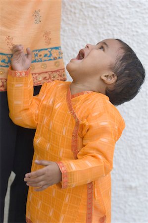 Side profile of a boy crying Foto de stock - Sin royalties Premium, Código: 630-01491110