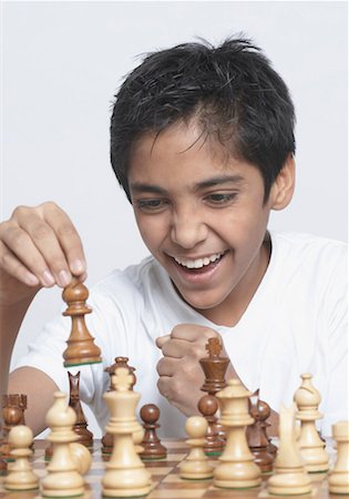 simsearch:630-01491544,k - Close-up of a boy playing chess Stock Photo - Premium Royalty-Free, Code: 630-01491559