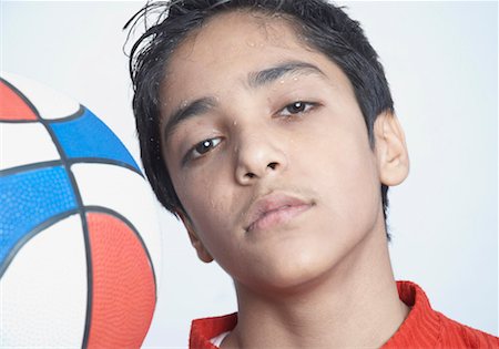 simsearch:630-01491544,k - Portrait of a boy with a basketball looking serious Stock Photo - Premium Royalty-Free, Code: 630-01491550