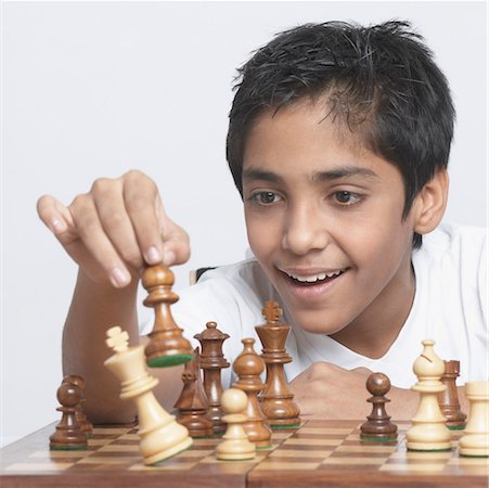 simsearch:700-00075674,k - Close-up of a boy playing chess Stock Photo - Premium Royalty-Free, Code: 630-01491560