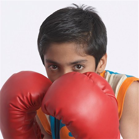 simsearch:630-01491544,k - Portrait of a boy wearing a boxing glove Stock Photo - Premium Royalty-Free, Code: 630-01491576