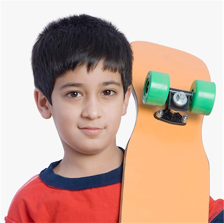 simsearch:630-01491544,k - Portrait of a boy holding a skateboard Stock Photo - Premium Royalty-Free, Code: 630-01491697