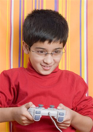simsearch:630-01491544,k - Close-up of a boy playing video game Stock Photo - Premium Royalty-Free, Code: 630-01491705