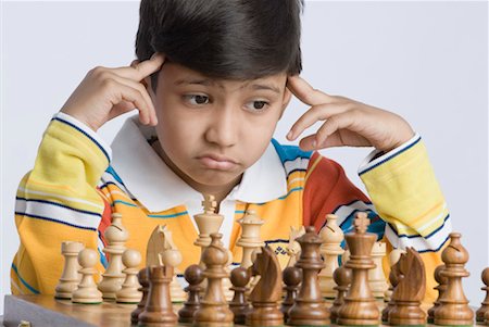 simsearch:630-01491544,k - Close-up of a boy playing chess Stock Photo - Premium Royalty-Free, Code: 630-01491729