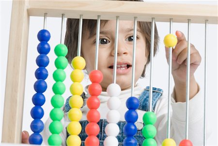 simsearch:630-01491544,k - Close-up of a boy playing with an abacus Stock Photo - Premium Royalty-Free, Code: 630-01491934