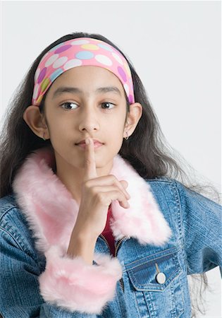 preteens fingering - Portrait of a girl with her finger on her lips Stock Photo - Premium Royalty-Free, Code: 630-01492246