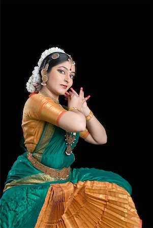 Portrait of a young woman performing Bharatnatyam Stock Photo - Premium Royalty-Free, Code: 630-01492398