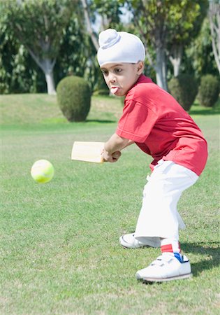 Side profile of a boy playing cricket Stock Photo - Premium Royalty-Free, Code: 630-01492627