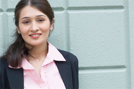 pakistani ethnicity - Portrait of a businesswoman smiling Stock Photo - Premium Royalty-Free, Code: 630-01492709