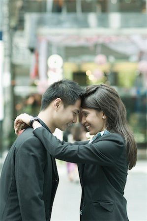 pictures of people hugging each other - Couple in formal clothes embracing each other Stock Photo - Premium Royalty-Free, Code: 630-01492783