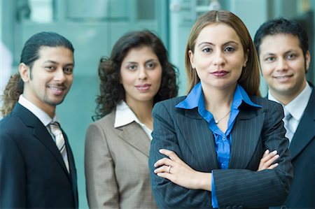 Portrait of four business executives standing together Stock Photo - Premium Royalty-Free, Code: 630-01492844