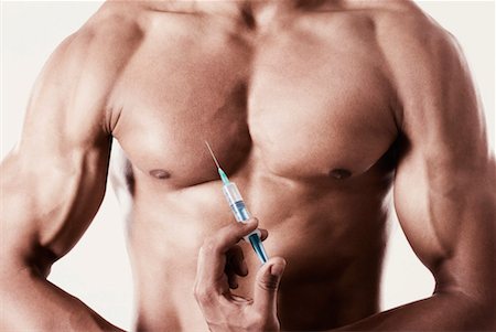 feeble - Mid section view of a man holding a syringe against his chest Stock Photo - Premium Royalty-Free, Code: 630-01493076