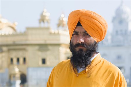 Portrait of a mid adult man, Golden Temple, Amritsar, Punjab, India Stock Photo - Premium Royalty-Free, Code: 630-01708295