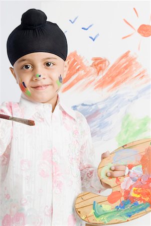Boy holding a paintbrush and a palette Foto de stock - Sin royalties Premium, Código: 630-01708795