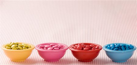 simsearch:630-01709492,k - Row of four bowls filled with candies Stock Photo - Premium Royalty-Free, Code: 630-01709455