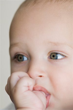 sucking - Close-up of a baby boy thumb sucking Stock Photo - Premium Royalty-Free, Code: 630-01709569