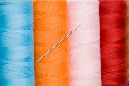 Close-up of a needle with four spools of thread Stock Photo - Premium Royalty-Free, Code: 630-01709643