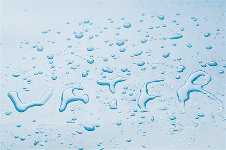 Water written with water droplets Stock Photo - Premium Royalty-Free, Code: 630-01709804