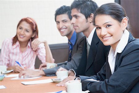 simsearch:630-01873072,k - Business executives discussing in a conference room Stock Photo - Premium Royalty-Free, Code: 630-01874083