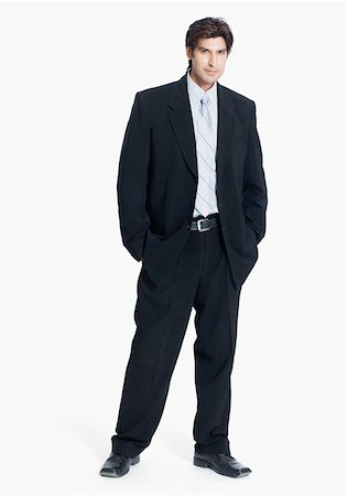 person standing cut out facing camera full length and one person - Portrait of a businessman standing with his hands in his pockets Stock Photo - Premium Royalty-Free, Code: 630-01874332