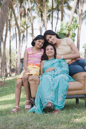 simsearch:630-01296751,k - Mature woman sitting with her two daughters in an armchair Stock Photo - Premium Royalty-Free, Code: 630-01874875