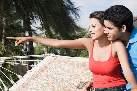 simsearch:630-01296756,k - Close-up of a young couple sitting in a hammock and smiling Foto de stock - Sin royalties Premium, Código: 630-01875082