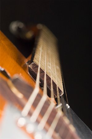 stringed instruments black background - Close-up of strings of a guitar Stock Photo - Premium Royalty-Free, Code: 630-01875576